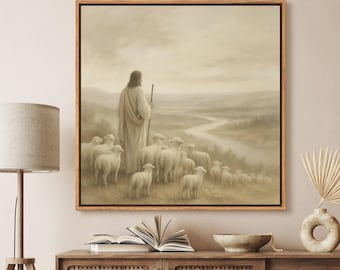 May include: A framed print depicting a shepherd with a staff, standing among a flock of sheep. The artwork is rendered in muted tones of beige and brown, with a landscape in the background. The print is displayed on a wooden cabinet.