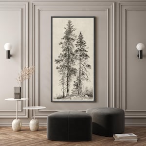 May include: Black framed wall art featuring a detailed black and white illustration of several tall pine trees. The artwork has a neutral background and is displayed in a modern living space with dark gray ottomans and a wooden floor.