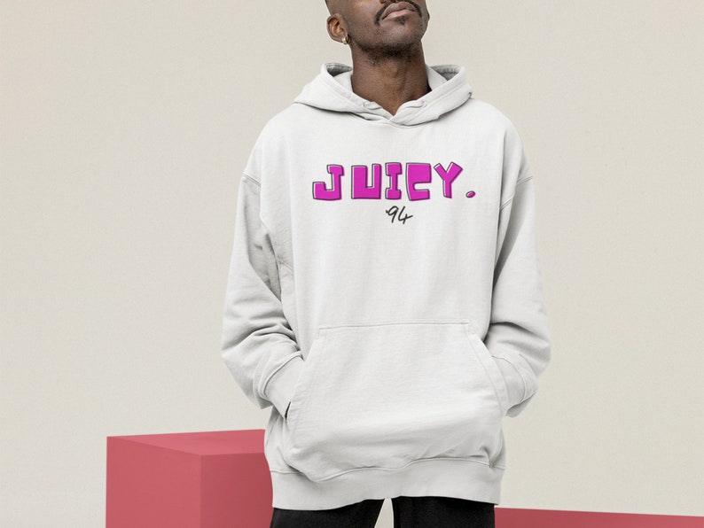 May include: A white hoodie with a pink "JUICY. 94" graphic print.