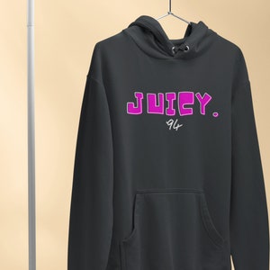 May include: Black hoodie with a pink "JUICY. 94" graphic on the front.