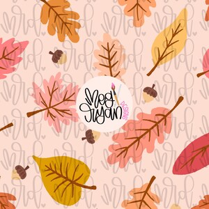 May include: A repeating pattern of autumn leaves and acorns in shades of orange, yellow, and pink on a light pink background. The design includes the text "Meg Ryan Designs" in a circular logo.