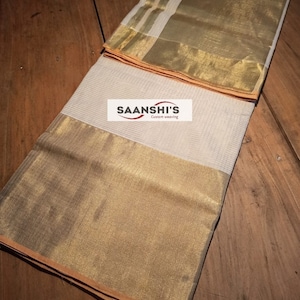 pure handloom micro check saree with 3 inch on top and 9 inch in the botton
