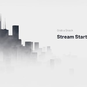 May include: A black and white image of a city skyline with tall buildings obscured by fog. The text "Grab a Snack Stream Starting Soon" is in the top right corner of the image.