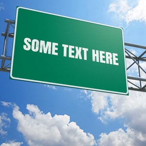 May include: A green road sign with white text that reads "SOME TEXT HERE" against a blue sky with white clouds.