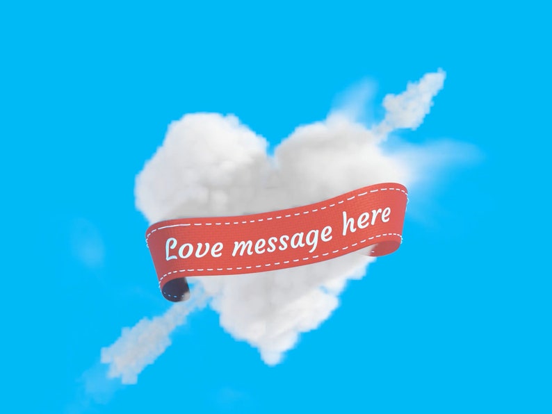 Puede incluir: Una nube blanca con forma de coraz&oacute;n con una cinta roja que dice "Love message here" sobre un fondo azul.