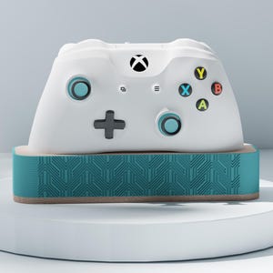 Könnte beinhalten: Ein Set aus drei Keramikbechern mit gesprenkelter, matter Oberfläche. Die Becher sind in Creme-, Hellgrau- und Dunkelgrautönen gehalten. Jeder Becher hat ein schlichtes, minimalistisches Design.