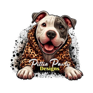 May include: A white and gray pit bull terrier wearing a leopard print hoodie. The dog is smiling and looking at the camera. The text "Pittie Party Designs" is below the dog.