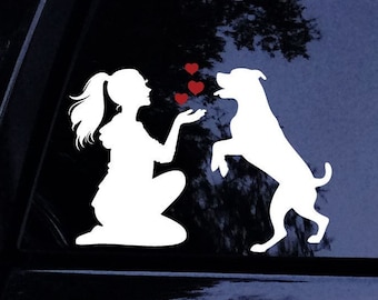 May include: A white silhouette of a person kneeling and throwing hearts to a white silhouette of a dog standing on its hind legs. The hearts are red.