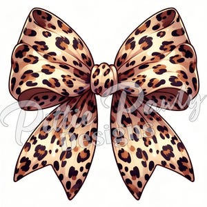 May include: A large brown and tan leopard print bow. The bow is made of fabric and has a shiny finish.