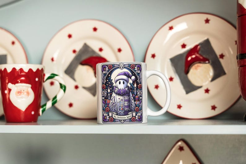 May include: White ceramic mug with a colorful illustration of a ghost wearing a purple scarf and hat. The text "The Christmas Spirit" is printed on the mug.
