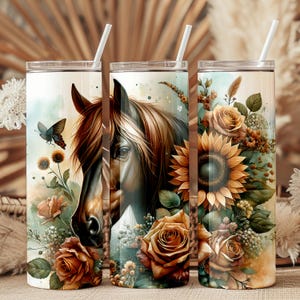 May include: Three stainless steel tumblers with a horse head and floral design. The tumblers feature a brown horse head with a white mane and a floral design with sunflowers, roses, and butterflies. The tumblers are a great way to enjoy your favorite beverage.