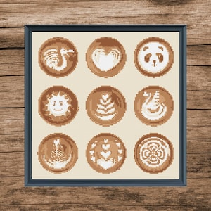 May include: A framed print featuring nine distinct latte art designs. The designs include a heart, a swan, a panda, a sun, a flower, and a few abstract designs. The designs are all in shades of brown and white.