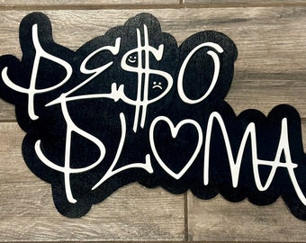 May include: Black and white sticker with the words "Peso $Love" in a stylized font. The dollar sign has a smiley face and a sad face.