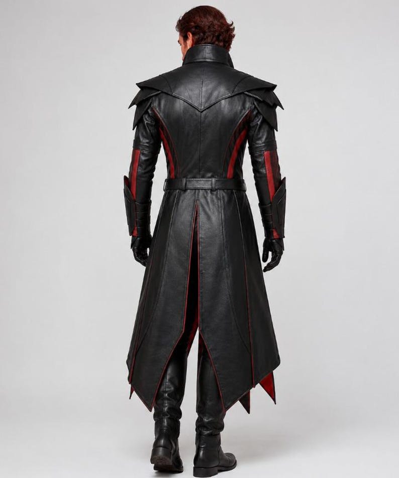 May include: A long black leather coat featuring red accents, a high collar, layered shoulder panels, and a belted waist. The coat has long sleeves with forearm guards, a split back hem, and is paired with black leather gloves and black boots.