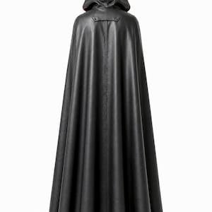 May include: A floor-length black hooded cloak featuring a smooth, leather-like texture. The garment includes a structured hood, a horizontal yoke detail at the upper back with visible stitching, and a full, flowing silhouette that drapes to the floor.
