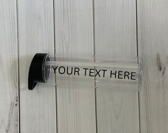May include: A clear plastic water bottle with a black lid and a straw. The bottle has the text "YOUR TEXT HERE" printed on it.