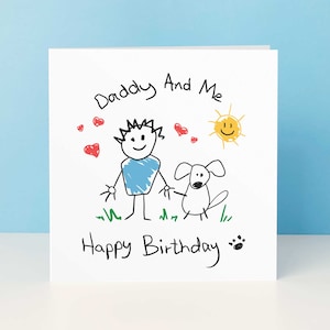 May include: A white card with a hand-drawn illustration of a person and a dog. The text reads "Daddy And Me Happy Birthday" with red hearts, a yellow sun, and green grass.