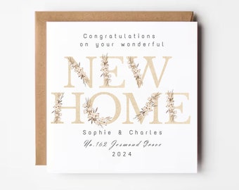 May include: A square greeting card with a brown border. The card reads "Congratulations on your wonderful NEW HOME" in gold letters, decorated with floral accents. The names "Sophie & Charles" and address "No. 162 Jesmond Grove" are also printed on the card, along with the year 2024.
