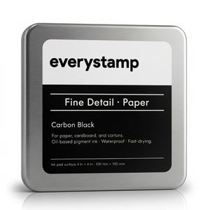 May include: A silver metal ink pad container with a white label that reads "everystamp". The label also says "Fine Detail • Paper" and "Carbon Black". The ink pad surface is 4 in x 4 in.
