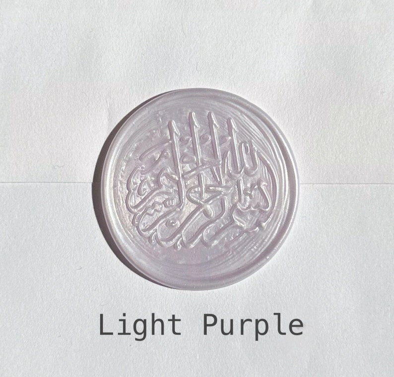 May include: A light purple wax seal with an Arabic inscription.