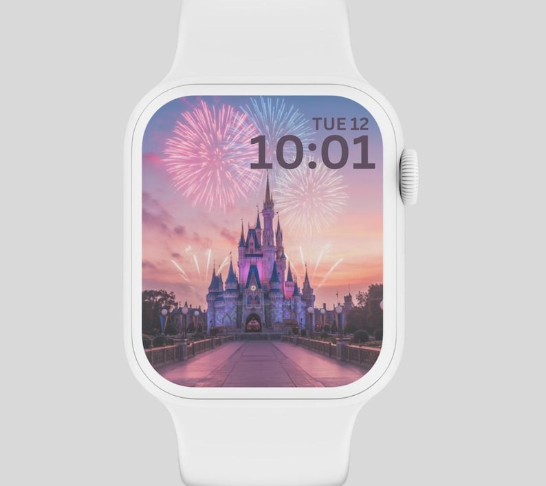 AnAn image of a gray background with a white Apple Watch and inside the Apple Watch is a wallpaper of Disney’s castle and beautiful pink and pastel colors with fireworks
