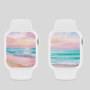 Könnte beinhalten: Zwei weiße Apple Watch Smartwatches mit einem rosa und blauen Aquarell-Strandmotiv auf dem Bildschirm. Die Szene zeigt einen Sandstrand, türkisfarbenes Wasser und einen rosa und orangen Sonnenuntergang.