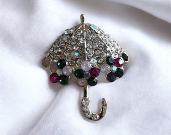 Goudkleurige paraplubroche: veelkleurige kristallen pin