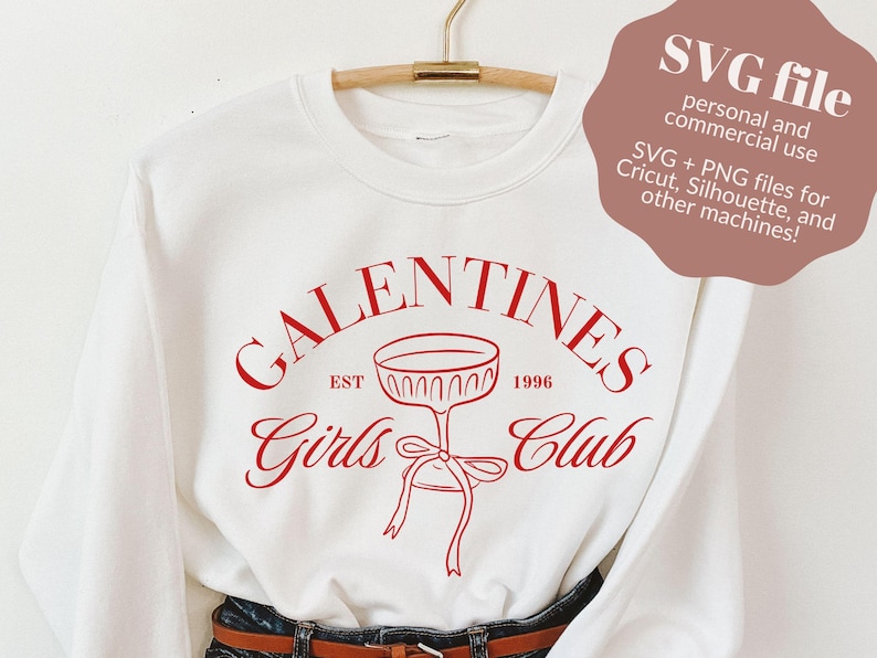 May include: White sweatshirt with a red graphic design that says "Galentines Girls Club Est. 1996" with a wine glass illustration.