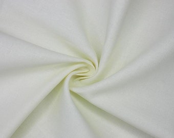 May include: Close-up of a cream-colored fabric with a subtle texture. The fabric is arranged in a spiral, creating soft folds and shadows. The material appears to be lightweight and suitable for clothing or home decor.