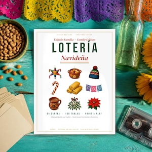 May include: A Loter&iacute;a Navide&ntilde;a game board featuring the text Edici&oacute;n Familia Family Edition, Loter&iacute;a Navide&ntilde;a, 54 Cartas, 100 Tablas, Print & Play. The board displays nine holiday illustrations including a pi&ntilde;ata, a pot, a knit hat, a candy cane, tamales, papel picado, a mug, mistletoe, and a poinsettia.