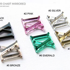 May include: A color chart featuring mirrored acrylic pieces in various colors. The chart includes black, pink, silver, emerald, bronze, and gold. The text "COLOUR CHART MIRRORED" and "MADE IN ITALY" are also visible.