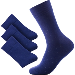 May include: Navy blue socks with a small polka dot design. The image displays three pairs of folded socks and one sock standing upright, all in the same color and pattern. The socks appear to be made of a soft, knitted material.