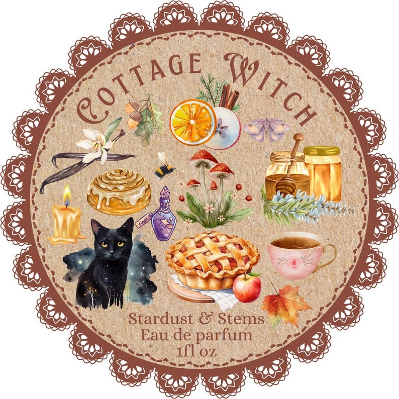 May include: A circular label with a brown scalloped border featuring the text Cottage Witch, Stardust & Stems, Eau de parfum, and 1fl oz. The design includes illustrations of a black cat, cinnamon roll, pie, honey jar, tea cup, mushrooms, and fruit.