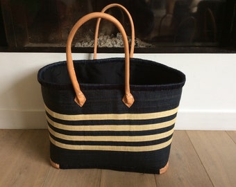 Very large double raffia basket with long handles and closing pouch.