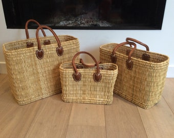 Rush basket with round leather handles