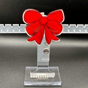 Porta badge con fiocco retrattile / Porta badge con fiocco in acrilico