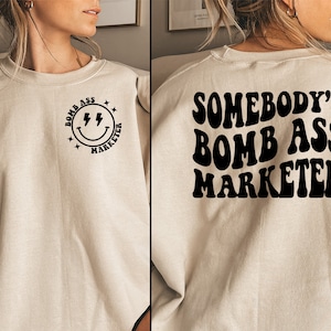 Somebody&#39;s Bomb Ass Marketer Sweatshirt Marketing Gift Ideas Somebodys Bomb Ass Marketer T Shirt Social Media Manager Shirt Cute T Market