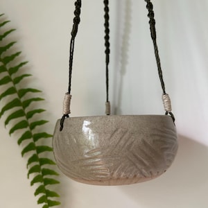 Hanging planter with macrame