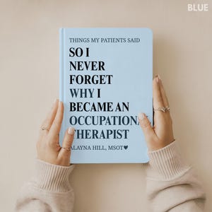May include: A pale blue notebook featuring the text "THINGS MY PATIENTS SAID" and "SO I NEVER FORGET WHY I BECAME AN OCCUPATION THERAPIST." The author's name, Alayna Hill, MSOT, is also printed on the cover. The word "BLUE" is in the upper right corner.