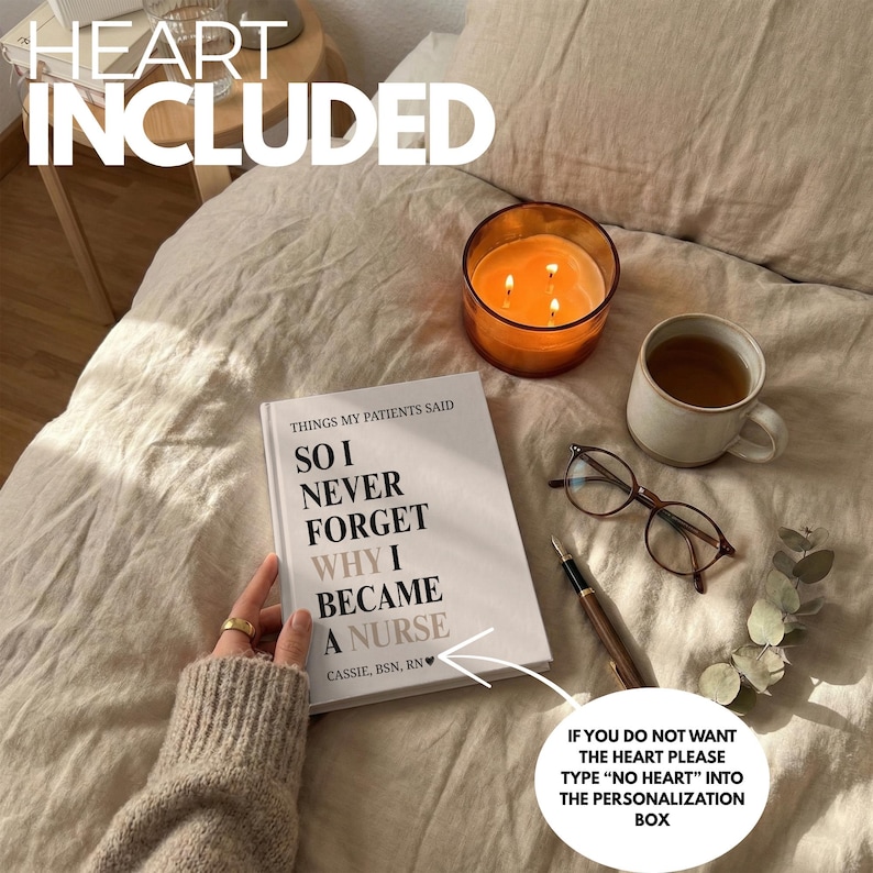 May include: A book titled "SO I NEVER FORGET WHY I BECAME A NURSE" with text "HEART INCLUDED". The image also shows a lit candle in a glass jar, a cup of tea, eyeglasses, and a pen. The text on the image says "IF YOU DO NOT WANT THE HEART PLEASE TYPE "NO HEART" INTO THE PERSONALIZATION BOX."