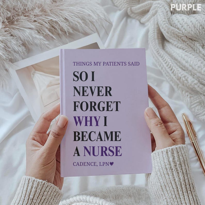 May include: A lavender notebook with the text "THINGS MY PATIENTS SAID SO I NEVER FORGET WHY I BECAME A NURSE" in black and purple. The notebook is held open, with a gold pen resting nearby.
