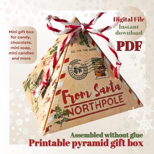 May include: A printable pyramid-shaped gift box with a vintage design, featuring the text "From Santa Northpole." The box is tied with red and white twine and is suitable for candy, chocolate, mini soap, and mini candles. The words "Digital File" and "PDF" are also visible.