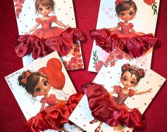 May include: Four greeting cards featuring illustrations of young girls in red dresses. Each card has a different pose and is decorated with red roses and hearts. The dresses have a 3D satin skirt.
