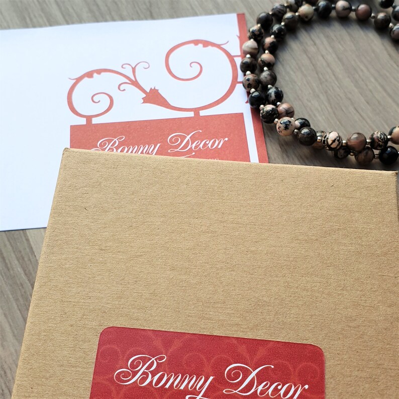 May include: A brown cardboard box with a red and white label that says "Bonny Decor".