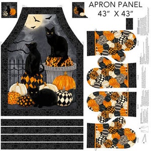 May include: A black and white Halloween-themed kitchen apron panel with a design of three black cats sitting on pumpkins and a full moon. The panel includes matching oven mitts.