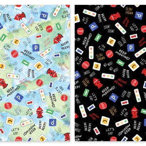May include: Two fabric patterns featuring road signs, traffic lights, and text like "Keep Moving!" and "Zoom!" The first pattern has a watercolor background in blue and green. The second pattern has a black background.