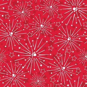 May include: Red fabric with a repeating pattern of white fireworks and stars. The fireworks have a central burst with radiating lines and dotted trails. Small white stars are scattered throughout the design.