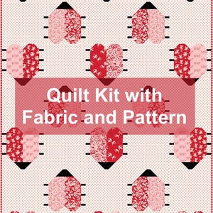 May include: A quilt kit with fabric and pattern, featuring a repeating pattern of heart shapes in red and pink. The hearts are composed of patterned fabric and set against a dotted background. The text "Quilt Kit with Fabric and Pattern" is displayed.