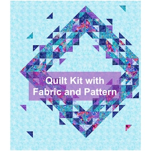 May include: A quilt kit with fabric and pattern. The quilt features a geometric design with a diamond shape in shades of blue, purple, and teal. The background is a light blue color. The text "Quilt Kit with Fabric and Pattern" is displayed.