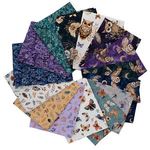 May include: A collection of fabric squares arranged in a circular pattern. The fabrics feature various nature-themed designs, including owls, butterflies, and foliage, in shades of blue, purple, brown, and green. The fabrics are likely for quilting or crafting.